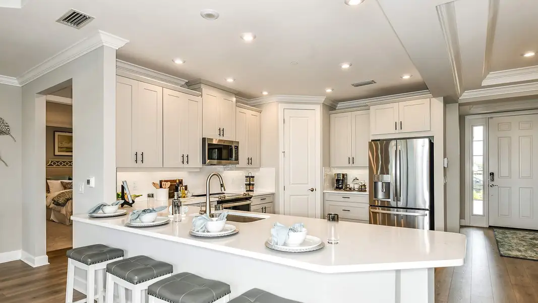 Furnished interior view inside a new home in Esplanade by the Islands Coach Homes, Naples (Image 3).