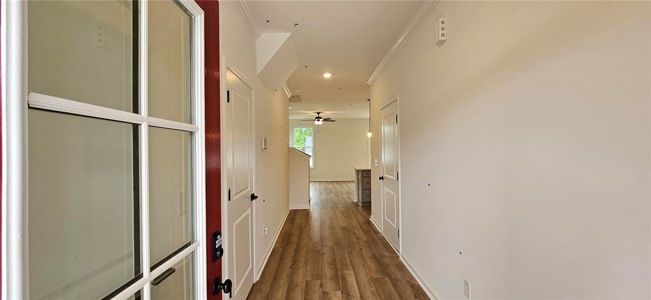 Step into this inviting entryway featuring warm wo Step into this inviting entryway featuring warm wo
