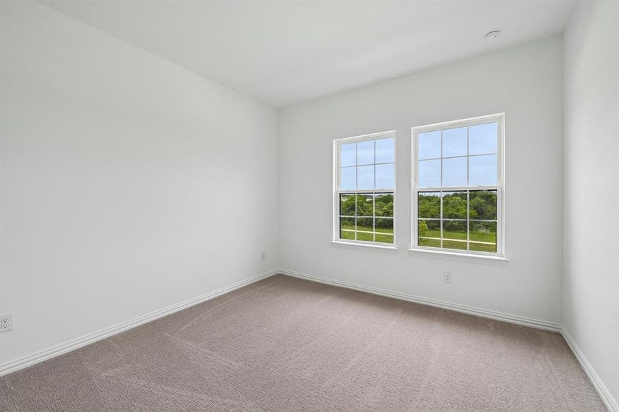 Guests will enjoy this nicely sized secondary bedroom. Guests will enjoy this nicely sized secondary bedroom.