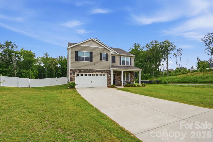 Front exterior of a new home in , Mount Holly, NC, highlighting curb appeal (Image 1). Front exterior of a new home in , Mount Holly, NC, highlighting curb appeal (Image 1).
