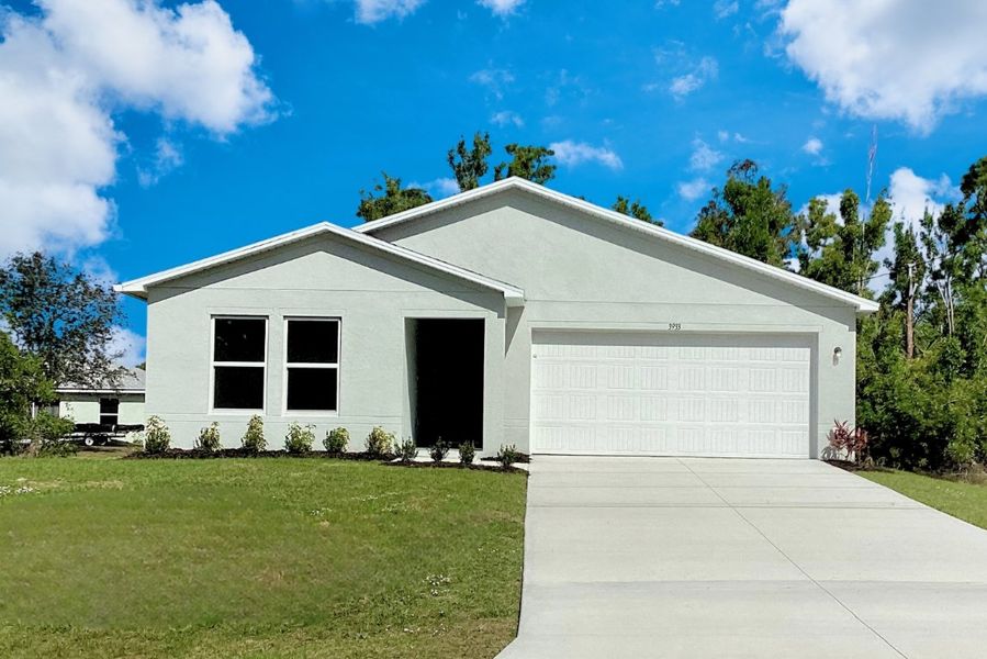 Front exterior of a new home in Cape Coral Classic, Cape Coral, FL, highlighting curb appeal (Image 1).