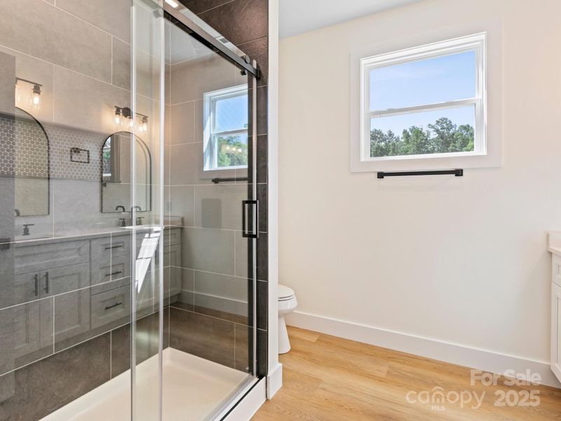 Custom tile shower has easy access and style.