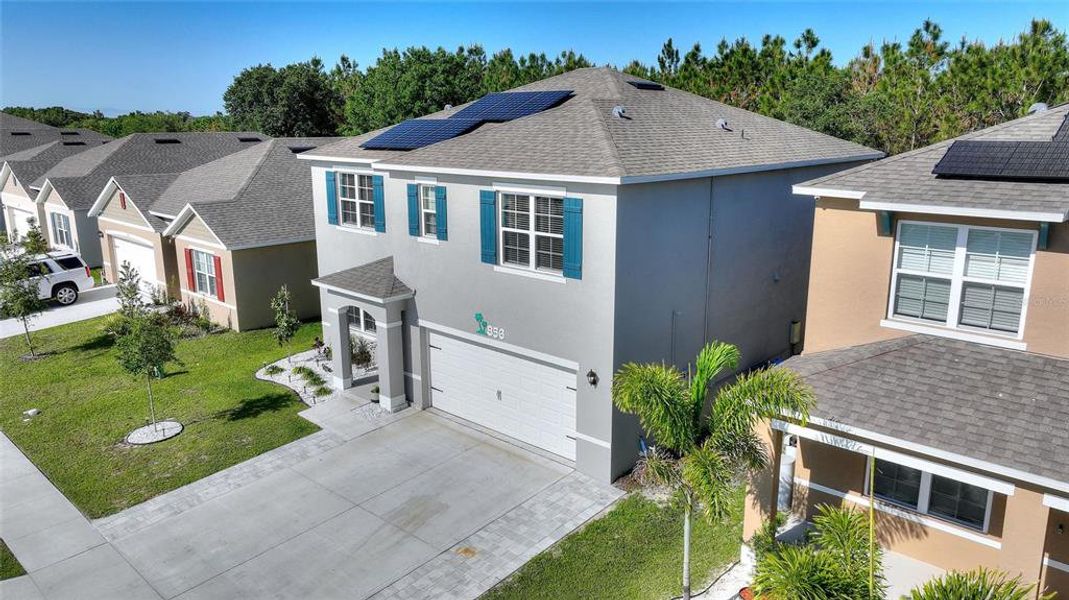 Front exterior of a new home in Squire's Grove, Winter Haven, FL, highlighting curb appeal (Image 18). Front exterior of a new home in Squire's Grove, Winter Haven, FL, highlighting curb appeal (Image 18).