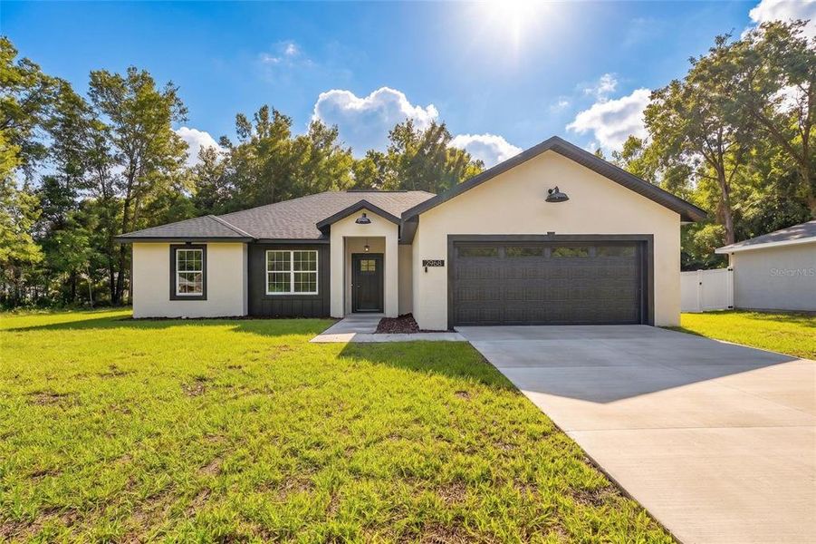 Front exterior of a new home in , Summerfield, FL, highlighting curb appeal (Image 1). Front exterior of a new home in , Summerfield, FL, highlighting curb appeal (Image 1).