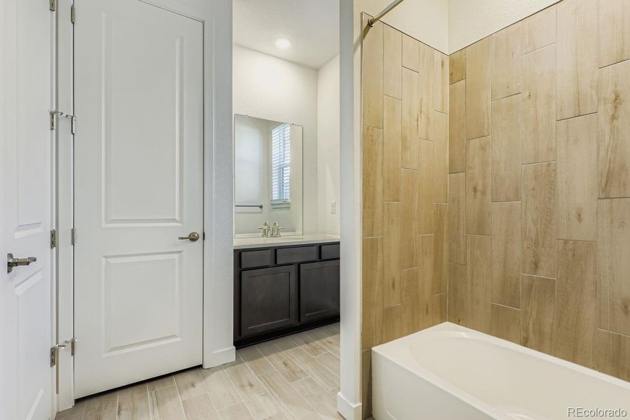 Furnished interior view inside a new home in Sunset Village: The Grand Collection, Erie (Image 7).