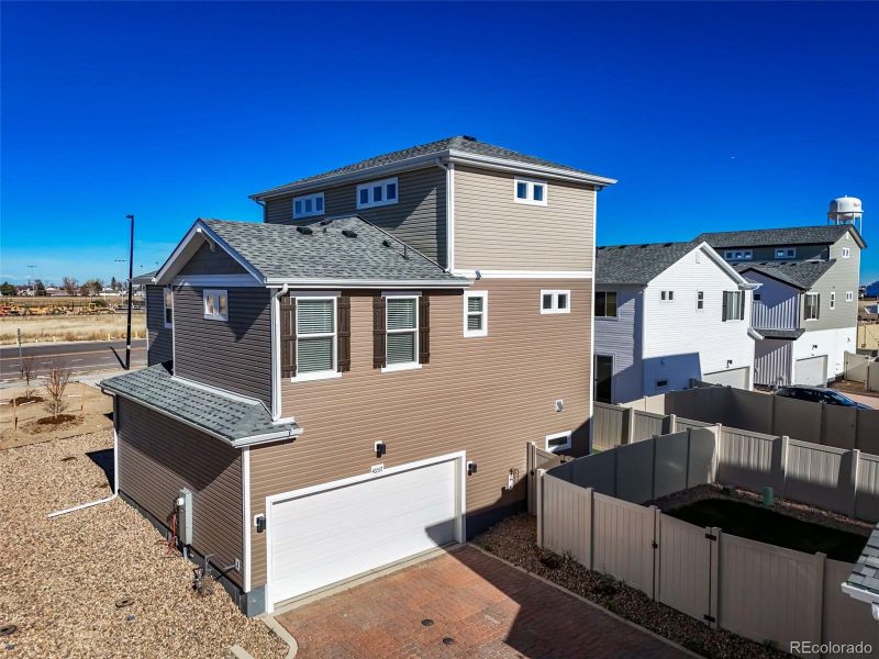 Exterior details and patio area of a home in Muegge Farms, Bennett (Image 26).