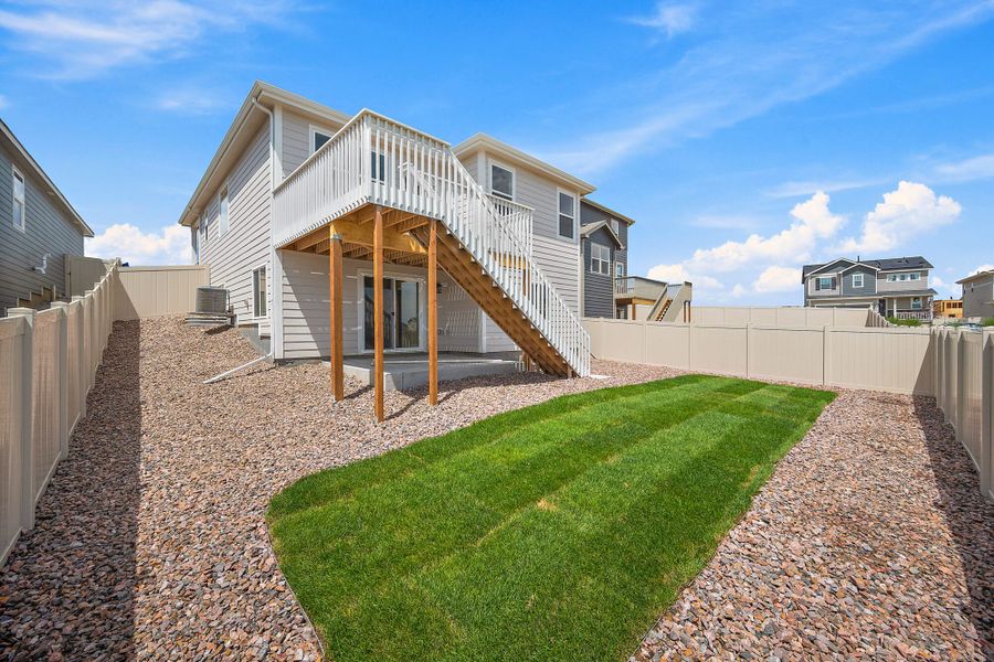 Front exterior of a new home in Trails at Aspen Ridge-3, Colorado Springs, CO, highlighting curb appeal (Image 20). Front exterior of a new home in Trails at Aspen Ridge-3, Colorado Springs, CO, highlighting curb appeal (Image 20).