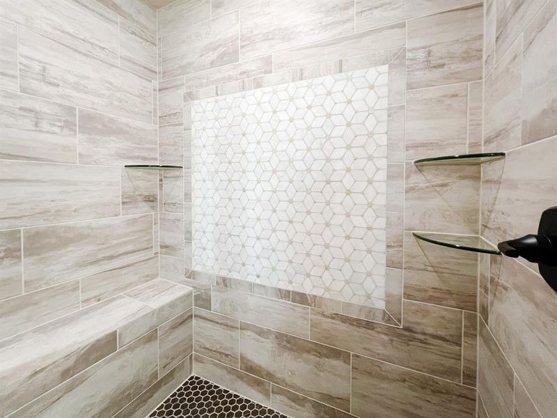 Bathroom featuring a tile shower Bathroom featuring a tile shower