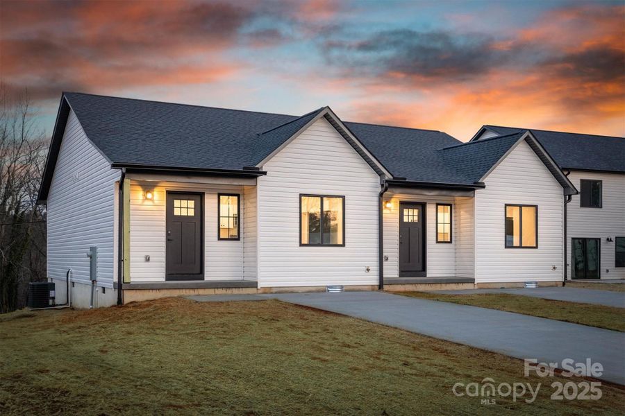 Front exterior of a new home in , Valdese, NC, highlighting curb appeal (Image 1). Front exterior of a new home in , Valdese, NC, highlighting curb appeal (Image 1).