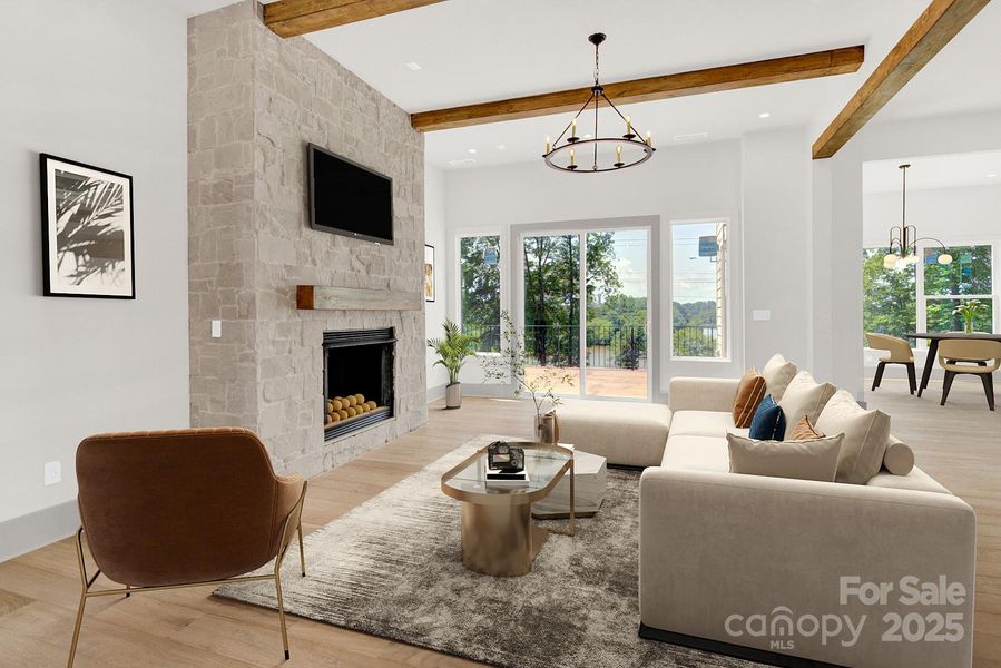 Virtually staged main level great room leads to lakefront patio Virtually staged main level great room leads to lakefront patio