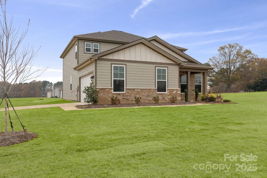 Front exterior of a new home in Running Creek, Locust, NC, highlighting curb appeal (Image 6). Front exterior of a new home in Running Creek, Locust, NC, highlighting curb appeal (Image 6).