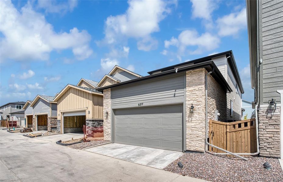 Front exterior of a new home in Painted Prairie, Aurora, CO, highlighting curb appeal (Image 18).