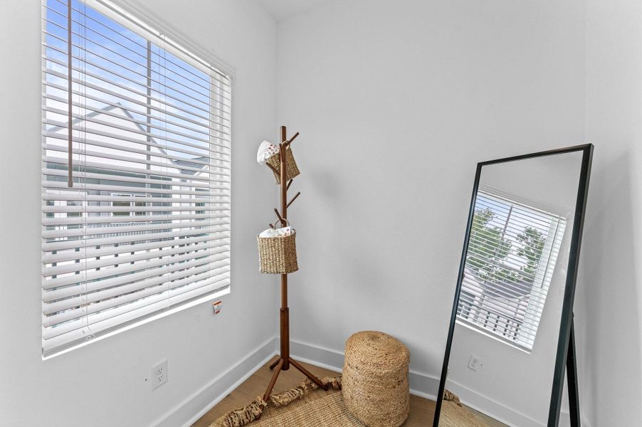 Luxurious second-floor primary bedroom designed to impress with soaring high ceilings, engineered hardwood flooring, and sleek contemporary finishes throughout. The space features two spacious closets for ample storage and organization, while large windows and French doors open to a private balcony—perfect for enjoying morning coffee or evening breezes. Whether styled for relaxation or sophistication, this bedroom is a true sanctuary. Luxurious second-floor primary bedroom designed to impress with soaring high ceilings, engineered hardwood flooring, and sleek contemporary finishes throughout. The space features two spacious closets for ample storage and organization, while large windows and French doors open to a private balcony—perfect for enjoying morning coffee or evening breezes. Whether styled for relaxation or sophistication, this bedroom is a true sanctuary.