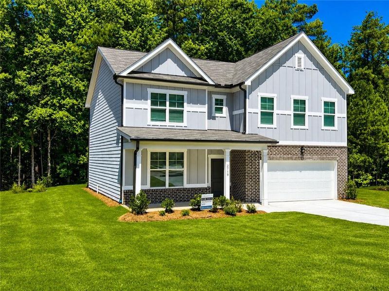 Front exterior of a new home in Whisper Creek, Atlanta, GA, highlighting curb appeal (Image 20). Front exterior of a new home in Whisper Creek, Atlanta, GA, highlighting curb appeal (Image 20).