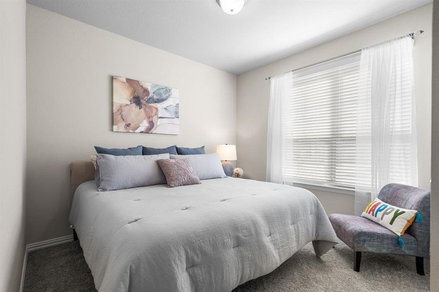 Guest bedroom is cozy and light-filled!