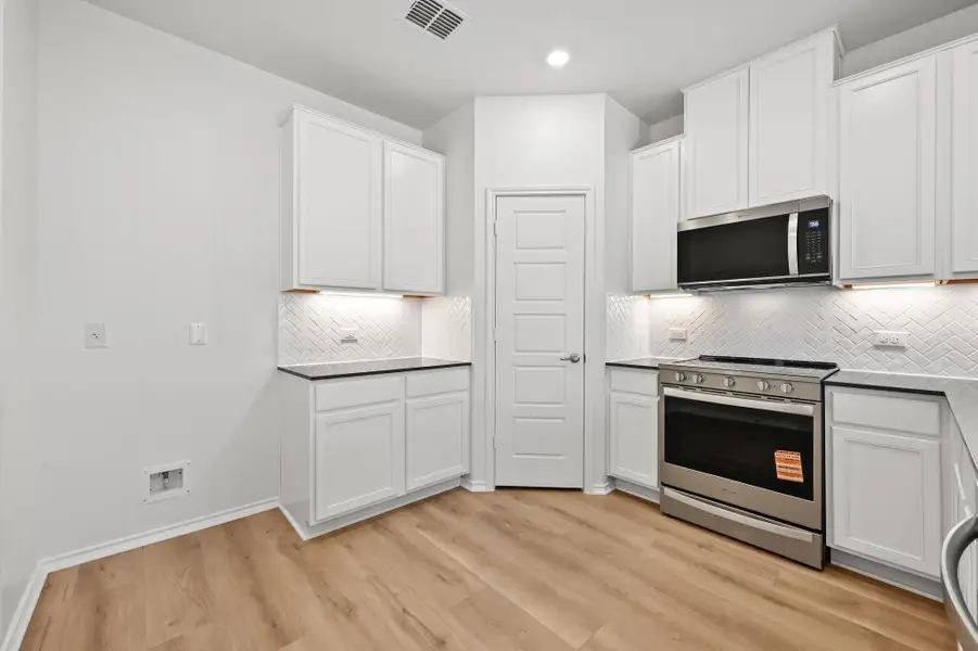 Furnished interior view inside a new home in Creekside at Estancia, Austin (Image 9). Furnished interior view inside a new home in Creekside at Estancia, Austin (Image 9).