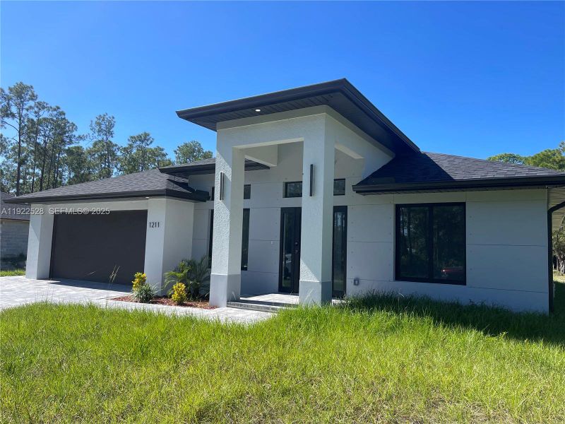 Exterior details and patio area of a home in , Lehigh Acres (Image 29). Exterior details and patio area of a home in , Lehigh Acres (Image 29).