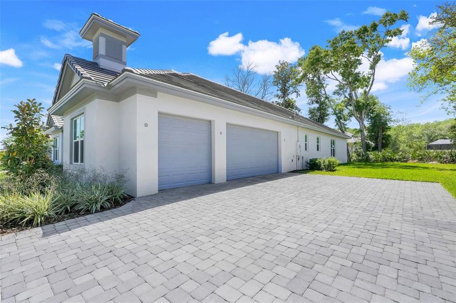 Front exterior of a new home in Toscana, Palm Coast, FL, highlighting curb appeal (Image 26). Front exterior of a new home in Toscana, Palm Coast, FL, highlighting curb appeal (Image 26).