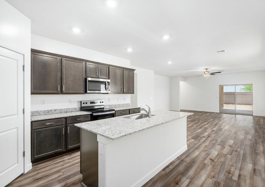 The kitchen seamlessly connects to the spacious living area. The kitchen seamlessly connects to the spacious living area.