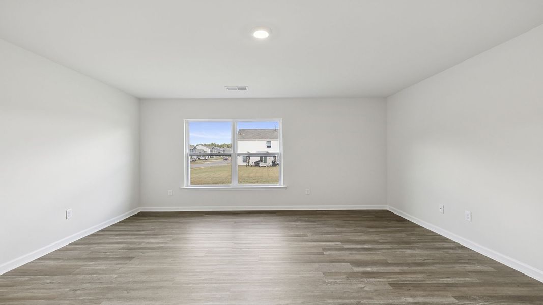 Spacious, unfurnished interior of a new home in Bentley Park, Greenwood (Image 24).