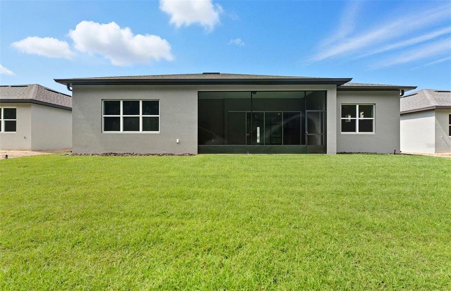 Exterior details and patio area of a home in Del Webb Stone Creek, Ocala (Image 2).