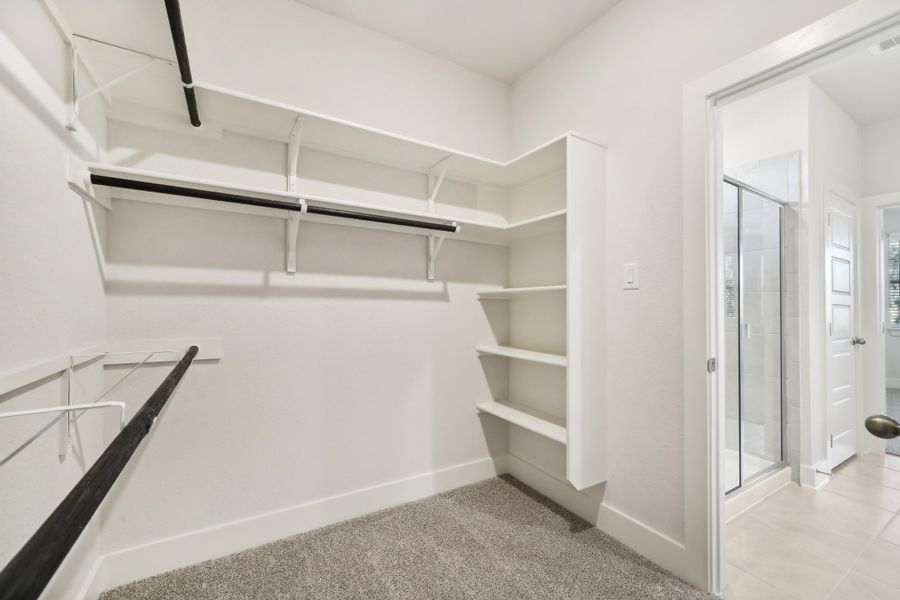 Primary suite walk-in closet in the Medina floorplan at a Meritage Homes community.