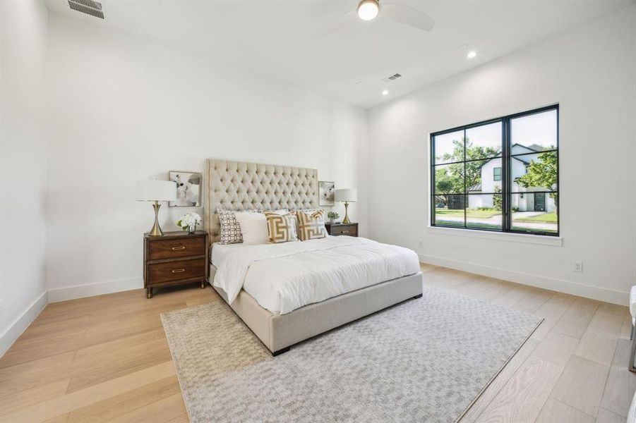 Primary downstairs bedroom with generous custom walk in closet and spa like private bathroom. Primary downstairs bedroom with generous custom walk in closet and spa like private bathroom.