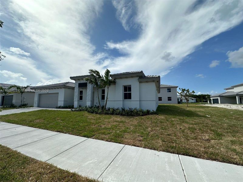 Front exterior of a new home in Hawthorne at Galiano Pointe, Miami, FL, highlighting curb appeal (Image 13).
