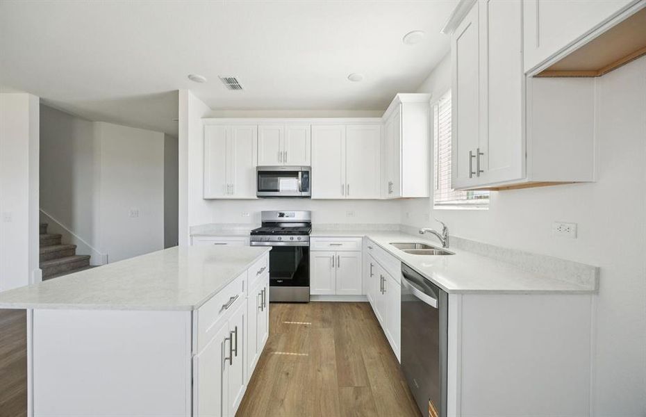 Spacious kitchen with eat-in bartop island Spacious kitchen with eat-in bartop island