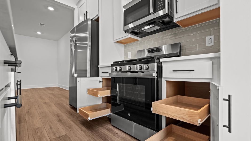 Modern kitchen with streamlined island for easy prep, storage, and gathering