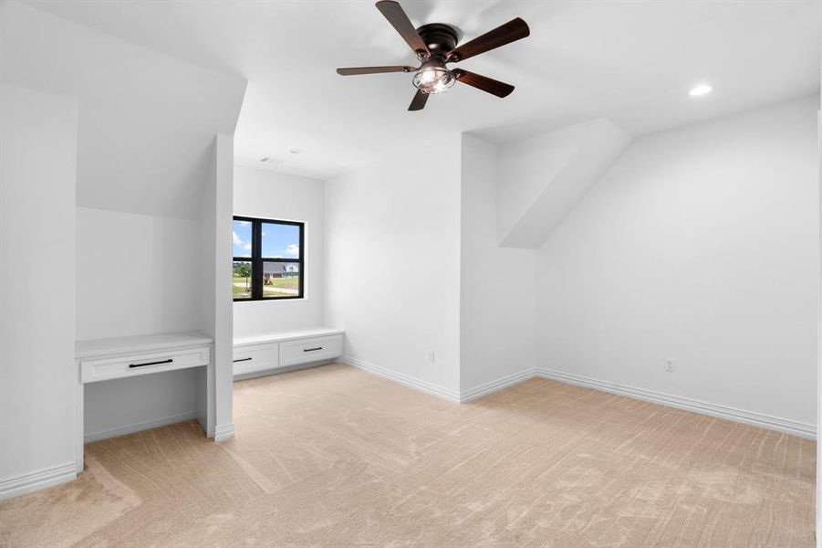 Additional living space with ceiling fan, light carpet, and recessed lighting Additional living space with ceiling fan, light carpet, and recessed lighting