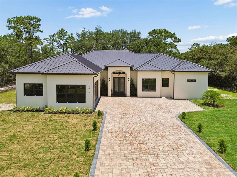 Front exterior of a new home in , Orlando, FL, highlighting curb appeal (Image 28). Front exterior of a new home in , Orlando, FL, highlighting curb appeal (Image 28).