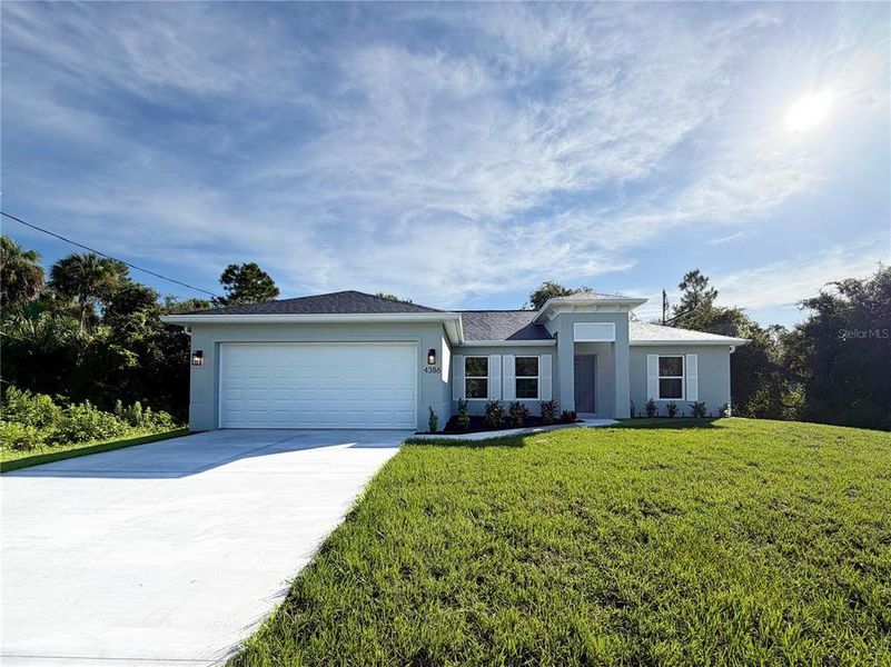 Front exterior of a new home in , North Port, FL, highlighting curb appeal (Image 24). Front exterior of a new home in , North Port, FL, highlighting curb appeal (Image 24).