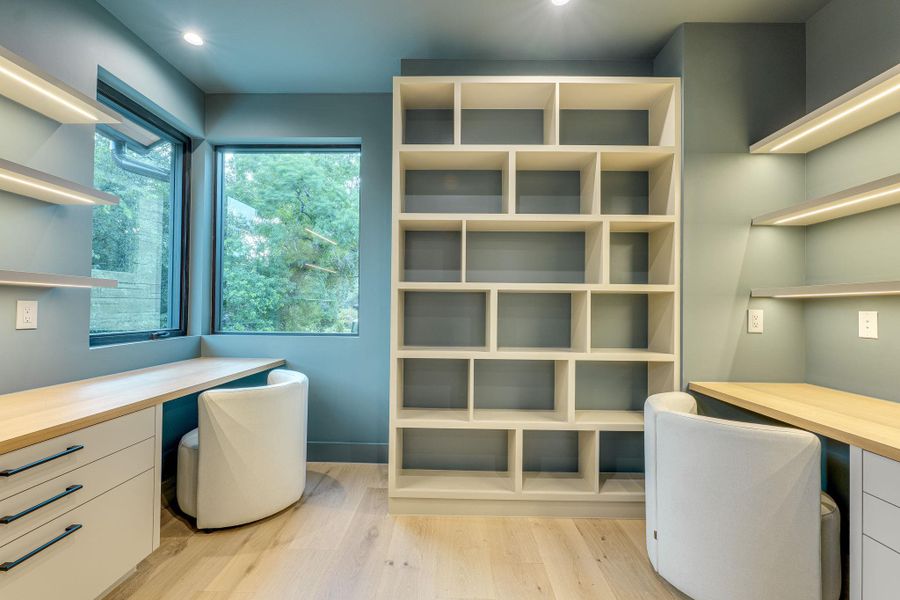 Custom built-in desks and shelving define this bright and efficient home office space. Custom built-in desks and shelving define this bright and efficient home office space.