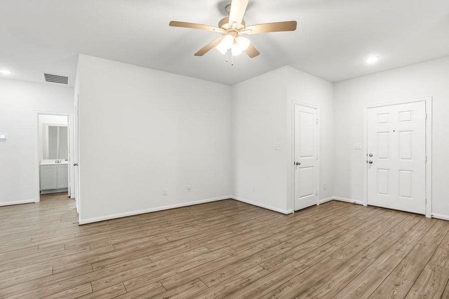 Spare room with recessed lighting, light wood-style flooring, and a ceiling fan