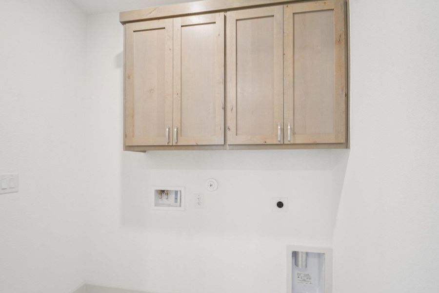 Laundry room with hookup for a gas dryer, hookup for a washing machine, hookup for an electric dryer, and cabinet space Laundry room with hookup for a gas dryer, hookup for a washing machine, hookup for an electric dryer, and cabinet space