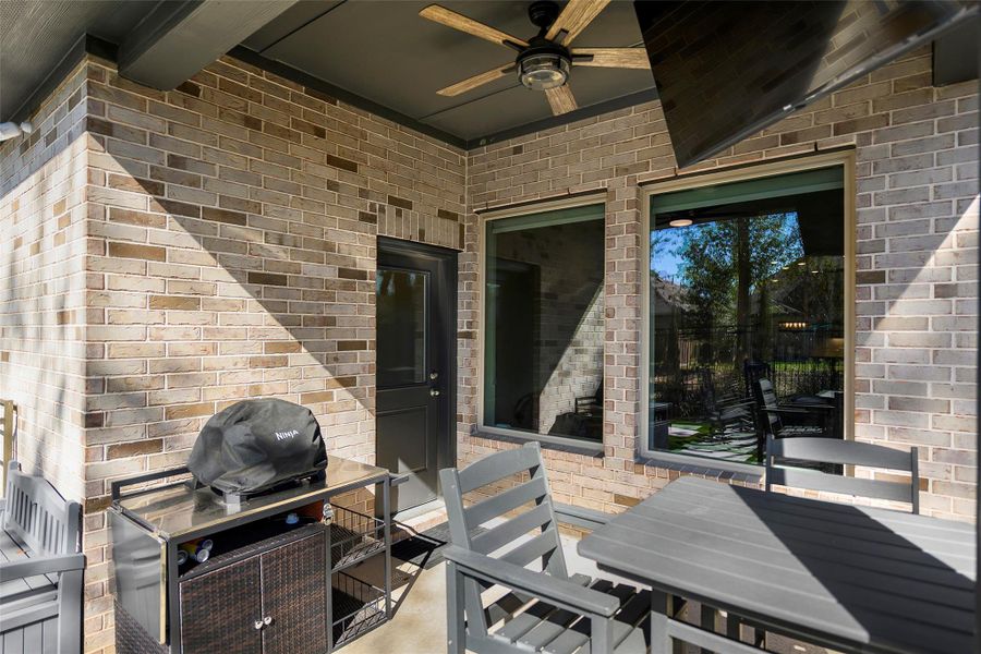Exterior details and patio area of a home in The Highlands 40', Porter (Image 25).