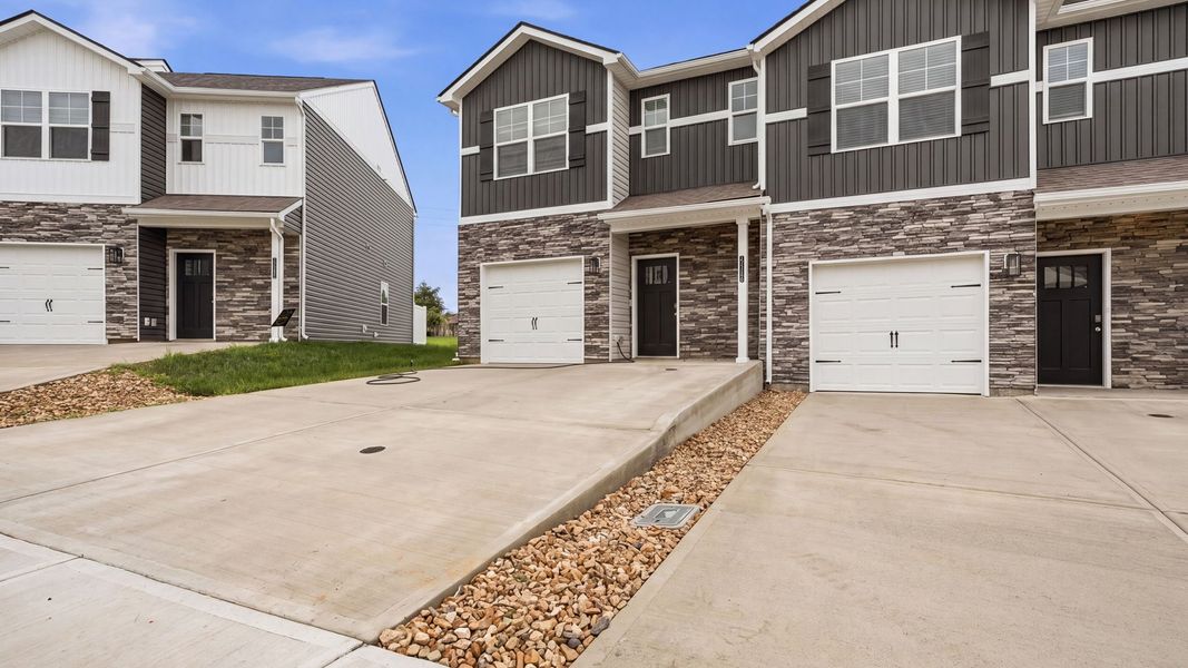 Front exterior of a new home in The Arbor Townhomes, Kingsport, TN, highlighting curb appeal (Image 2). Front exterior of a new home in The Arbor Townhomes, Kingsport, TN, highlighting curb appeal (Image 2).