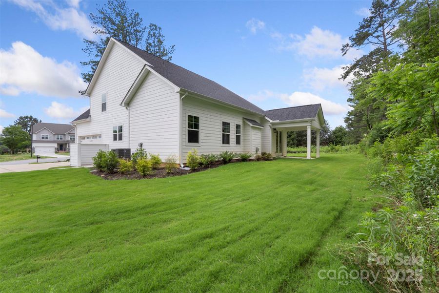 Exterior details and patio area of a home in Crescent Golf, Salisbury (Image 30).