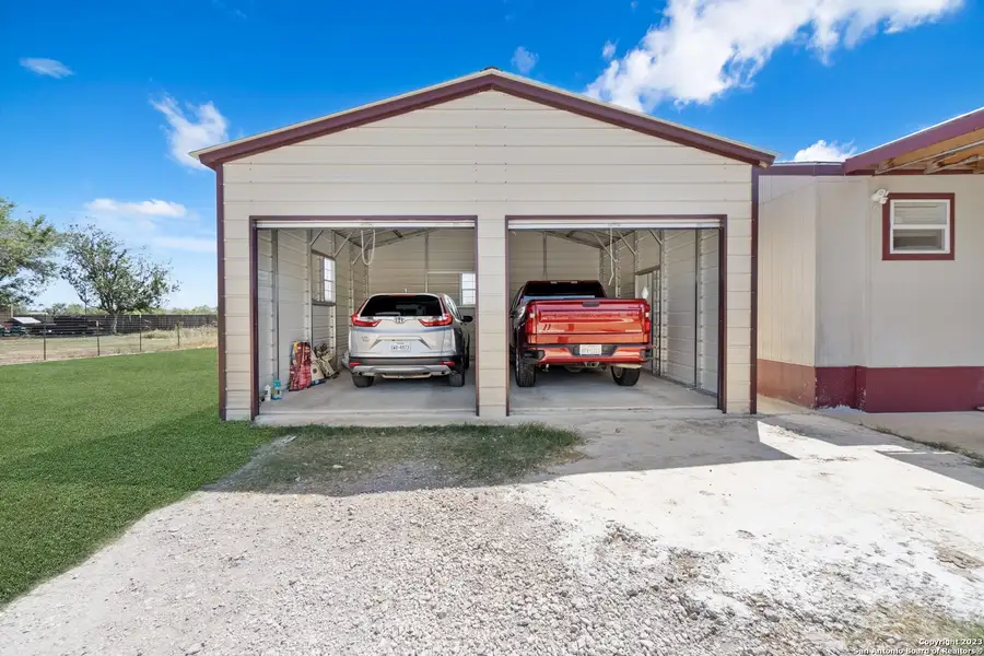 Front exterior of a new home in , Atascosa, TX, highlighting curb appeal (Image 1). Front exterior of a new home in , Atascosa, TX, highlighting curb appeal (Image 1).