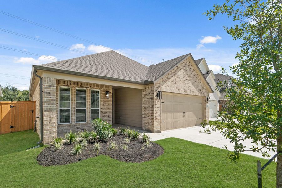 Front exterior of a new home in Sunterra North, Katy, TX, highlighting curb appeal (Image 17).