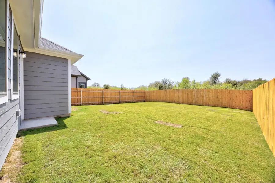 Exterior details and patio area of a home in Trinity Ranch, Elgin (Image 3).