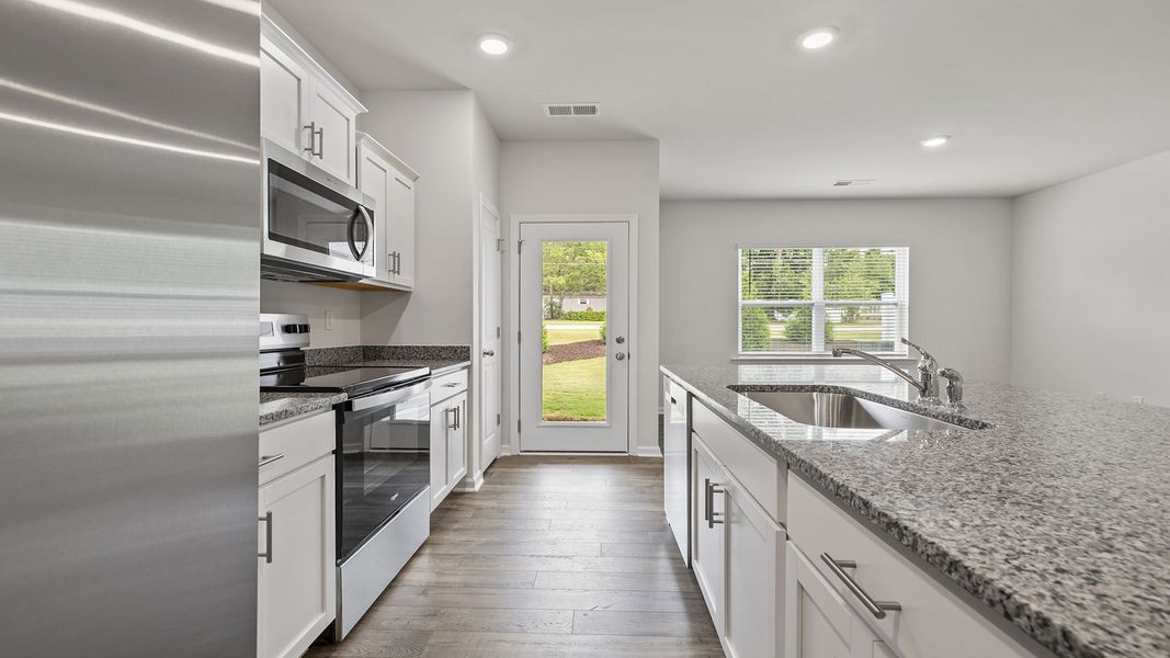 Furnished interior view inside a new home in Tanglewood Townes, Greenville (Image 9).