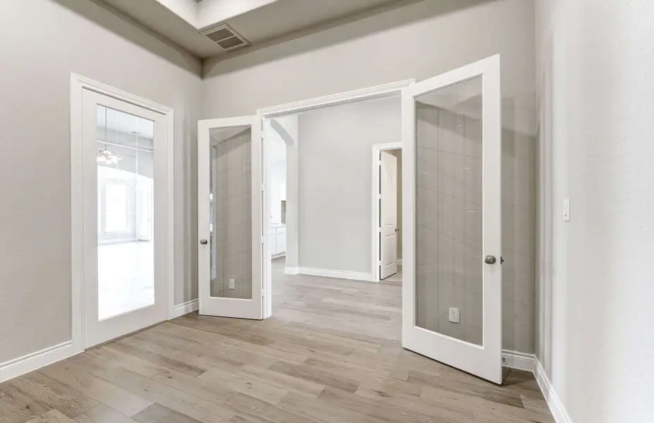 Representative unfurnished interior of a home built from the 2909 by Ravenna Homes in The Woodlands Hills 65′, Willis (Image 19). Representative unfurnished interior of a home built from the 2909 by Ravenna Homes in The Woodlands Hills 65′, Willis (Image 19).