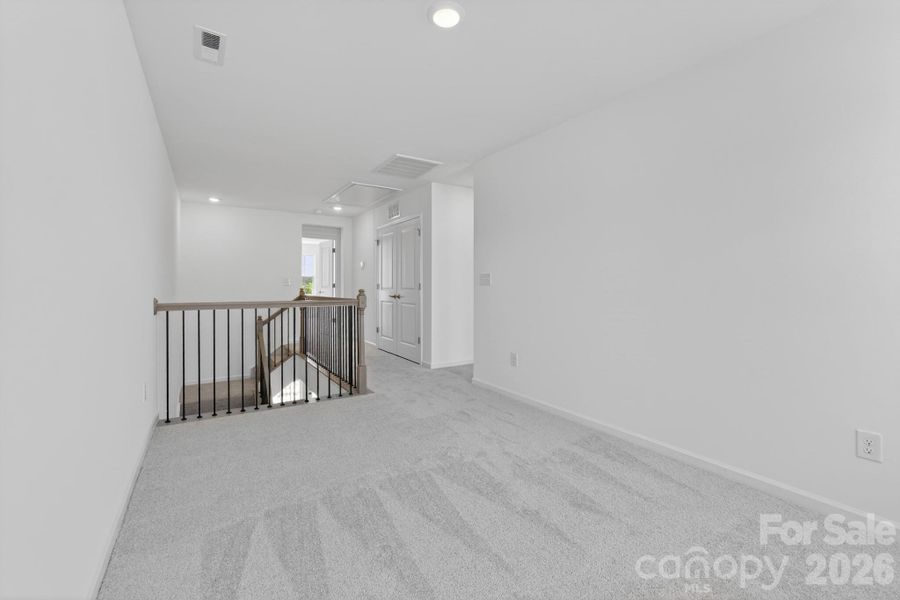 3rd floor open rail loft - great for a second tv room, play room or craft room !