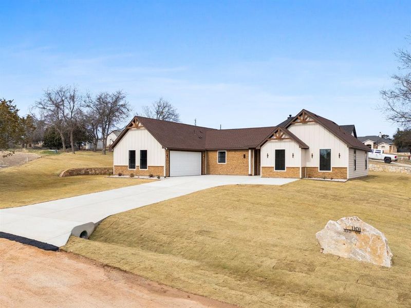 Front exterior of a new home in , Granbury, TX, highlighting curb appeal (Image 24). Front exterior of a new home in , Granbury, TX, highlighting curb appeal (Image 24).