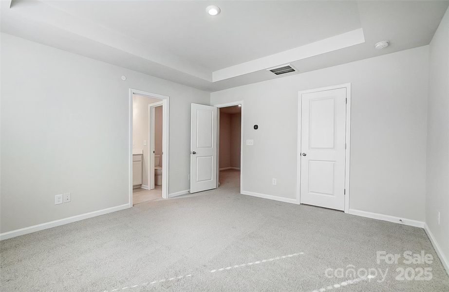 Primary Suite with View to Closet and Bathroom-Photo Similar to Subject Property