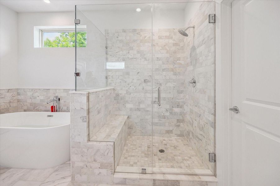 Primary Bathroom's Separate Frameless Shower * Surrounded by Marble and Glass. Primary Bathroom's Separate Frameless Shower * Surrounded by Marble and Glass.