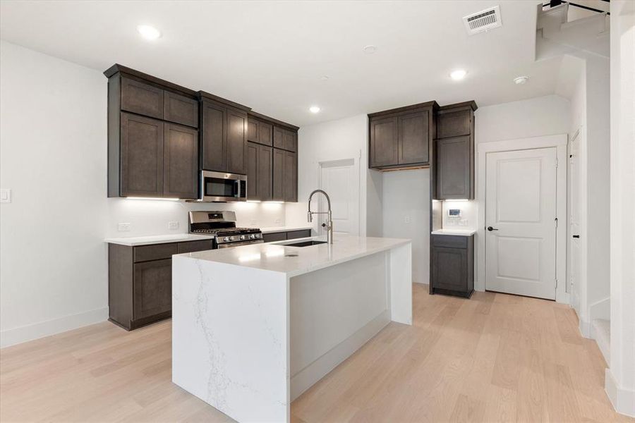 The oversized kitchen island is the hub of your new dream kitchen!