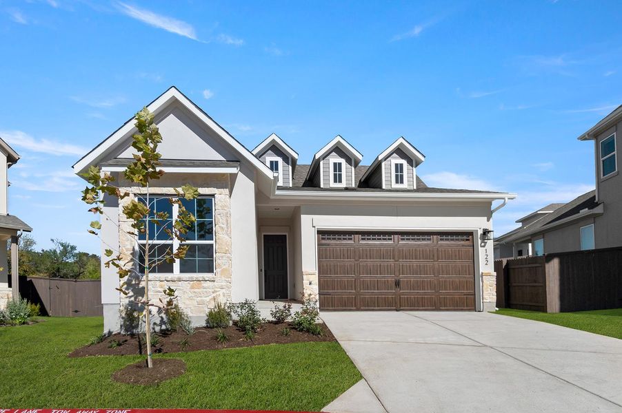 Front exterior of a new home in Cross Creek, Cedar Park, TX, highlighting curb appeal (Image 2).
